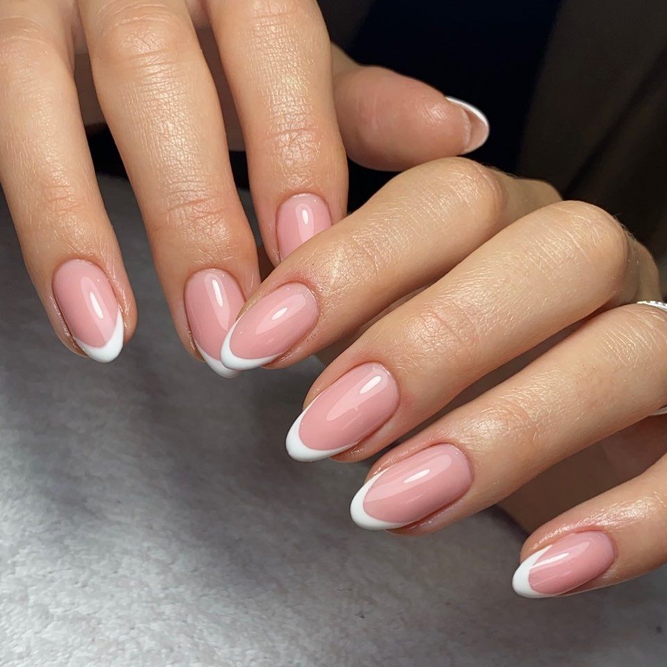 Glossy French manicure close-up